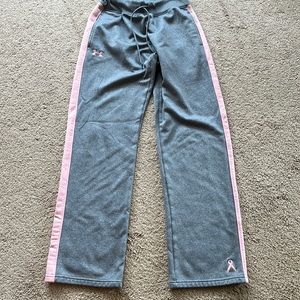 Under Armour sweats. Breast cancer awareness symbol on bottom of left pant leg.